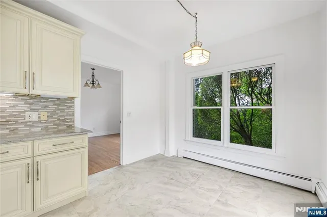 a view of an entryway with chandelier