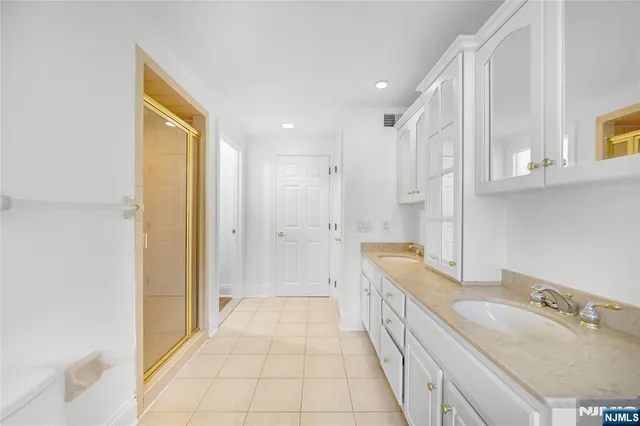 a bathroom with a sink a mirror and a bathtub