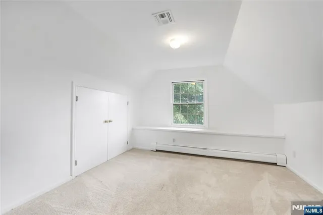 an empty room with a empty space and window