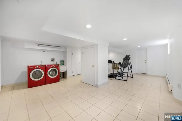 a view of a storage & utility room with a washer and dryer
