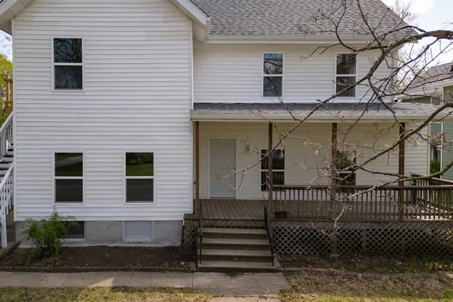 a view of a house with iron fence