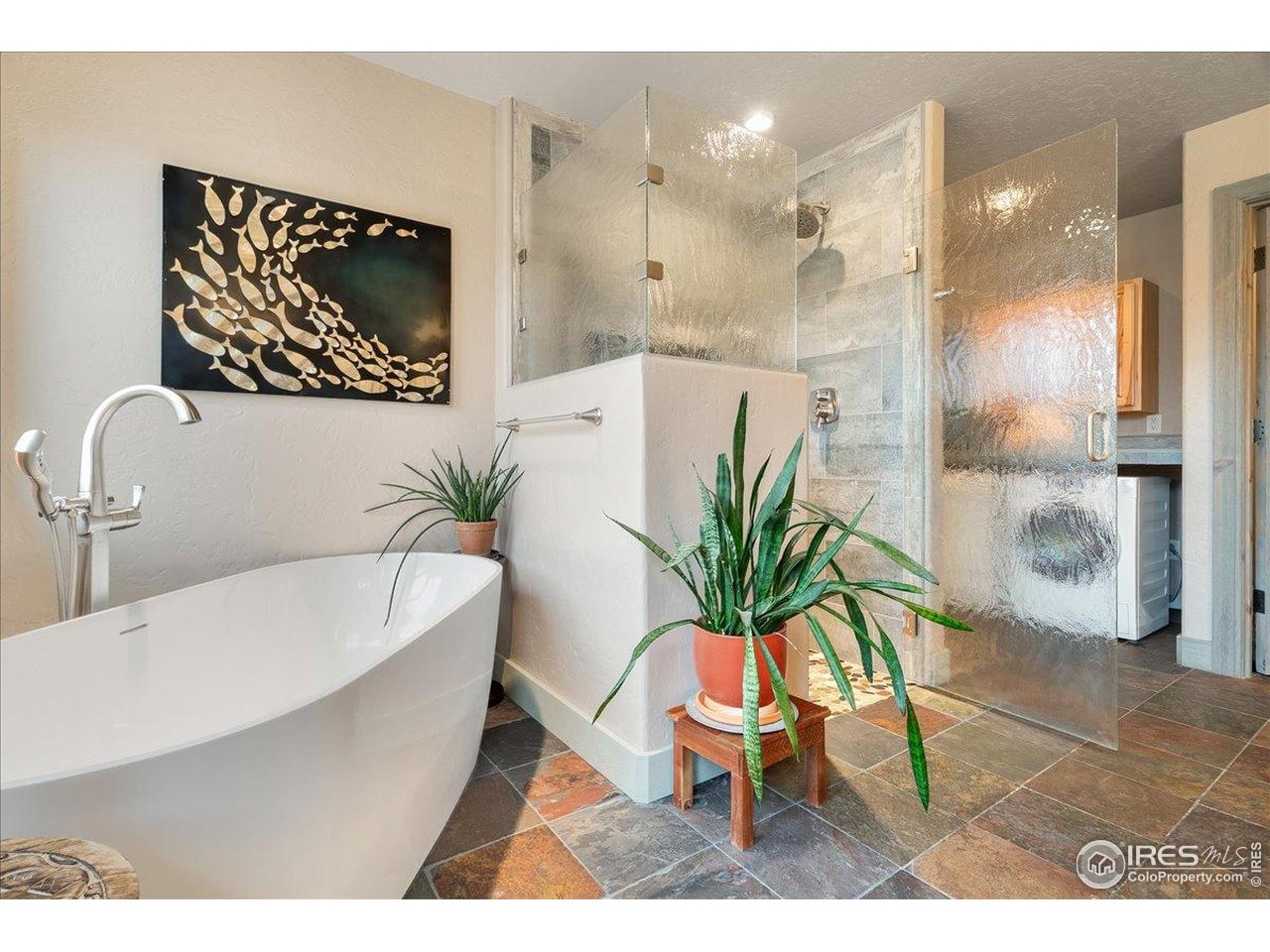 960 Ridge W Drive Windsor, CO 80550 - Photo 25 of 50 a picture of a bathroom with a tub and shower