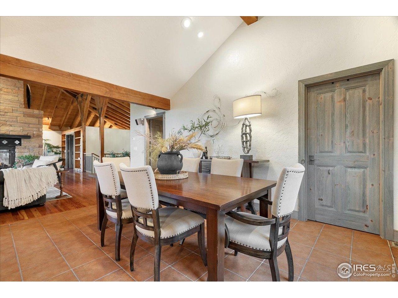 960 Ridge W Drive Windsor, CO 80550 - Photo 6 of 50 a view of a dining room with furniture and wooden floor