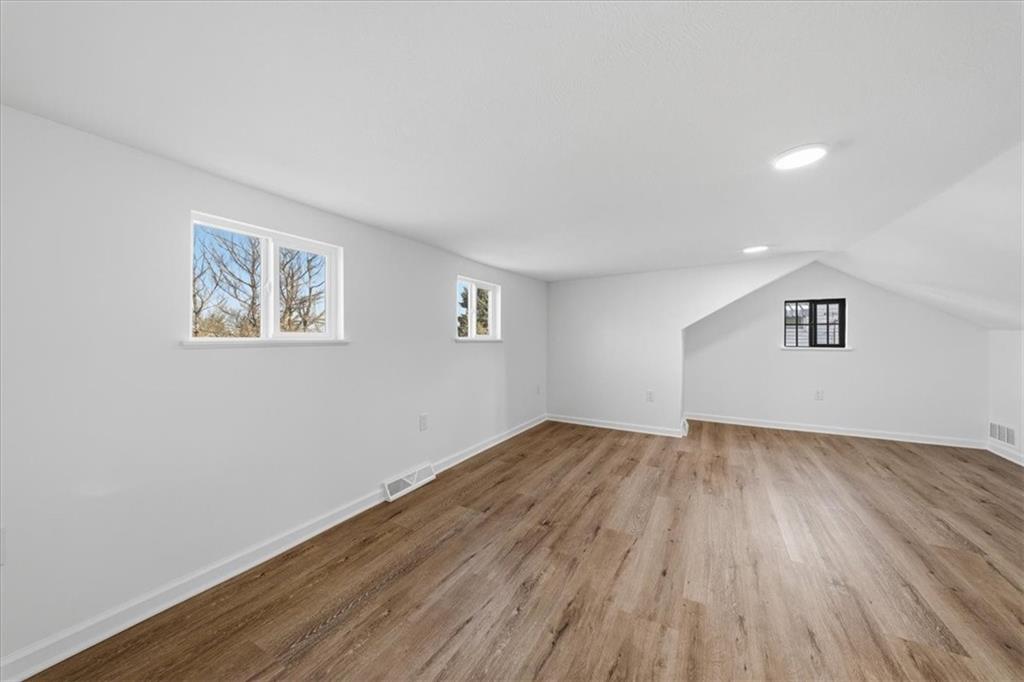 1216 Eckert Road Monaca, PA 15061 - Photo 22 of 30 an empty room with wooden floor and windows