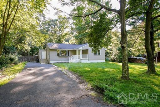 56 Haypress Road Cranbury, NJ 08512 - Photo 2 of 14 a view of a house with backyard and a tree