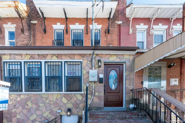 a front view of a house with a large window