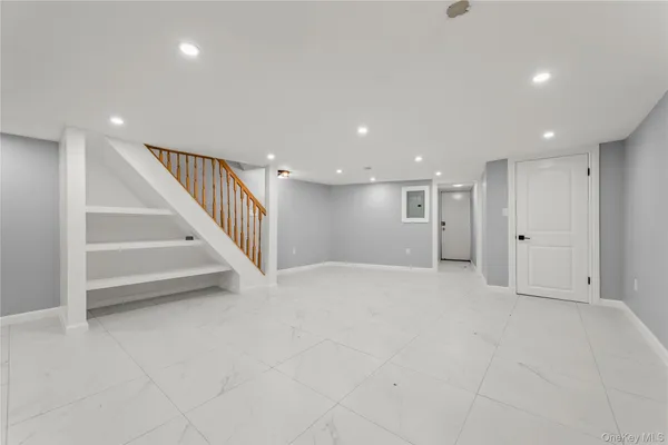 a view of storage and utility room with racks on the wall
