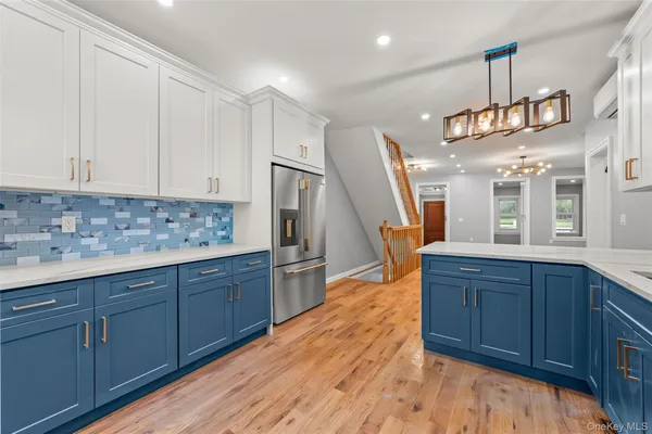 a kitchen with wooden cabinets and sink