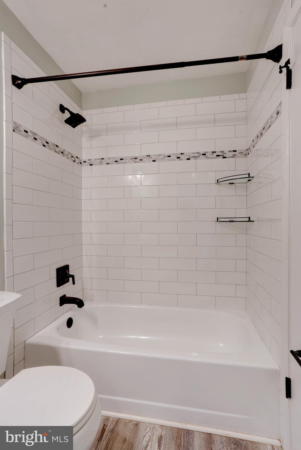 1159 Greenhill Road Arnold, MD 21012 - Photo 28 of 41 Modern bathroom with sleek tile design.