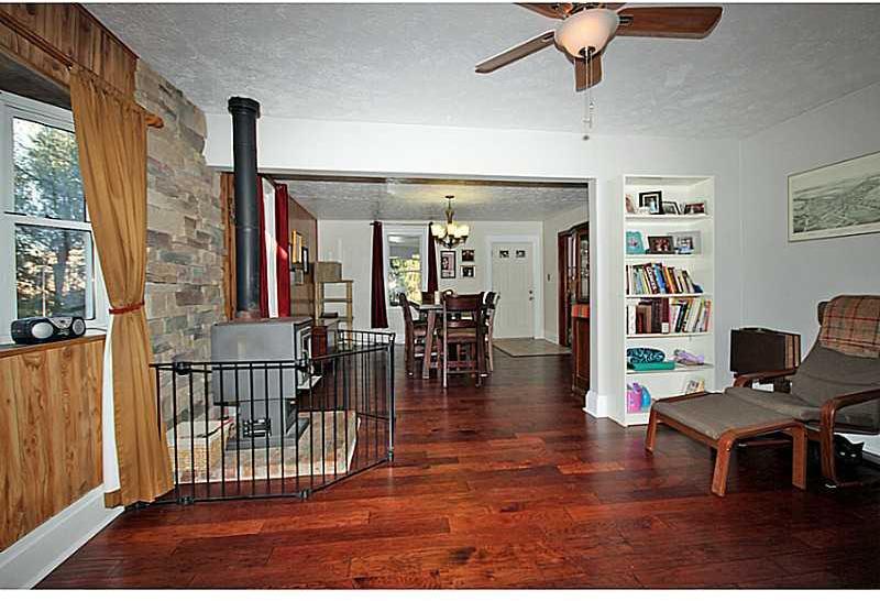 308 Marzolf Road Pittsburgh, PA 15209 - Photo 6 of 25 Living Room. Living room/Dining room combo with wood burning stove