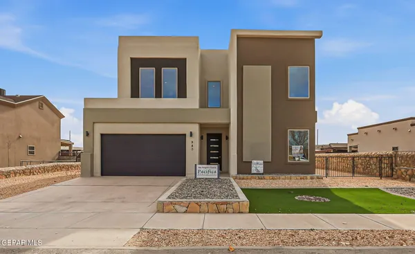 a front view of a house with yard