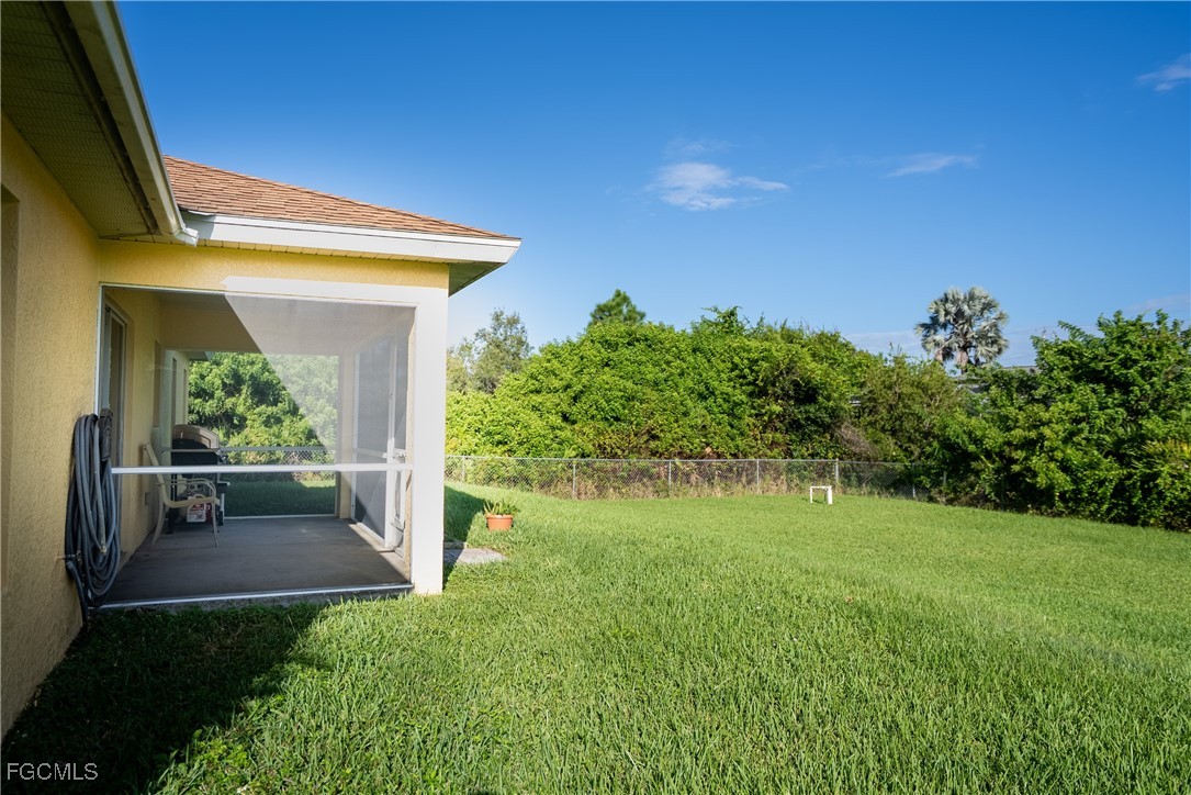 2516 13th Street Southwest Lehigh Acres, FL 33976 - Photo 3 of 16 a view of back yard of the house