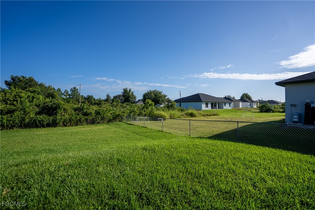 2516 13th Street Southwest Lehigh Acres, FL 33976 - Photo 4 of 16 a view of a golf course with a lake