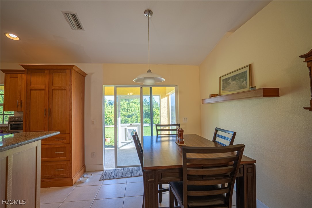 2516 13th Street Southwest Lehigh Acres, FL 33976 - Photo 7 of 16 a view of a dining room with furniture window and outside view