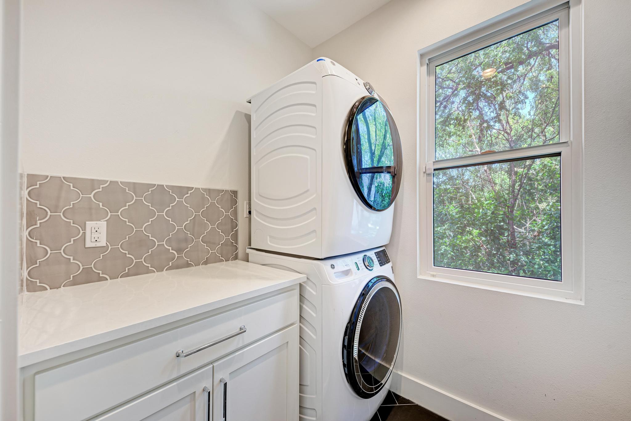 918 Cardinal Lane, Unit A Austin, TX 78704 - Photo 25 of 40 Convenient upstairs laundry room with space for folding clothes and storage.