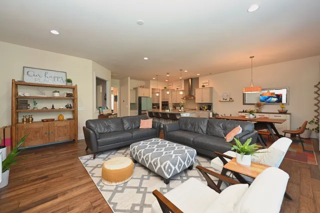 a dinning room and kitchen with a table chairs