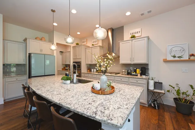 a bedroom with a bed and flat screen tv