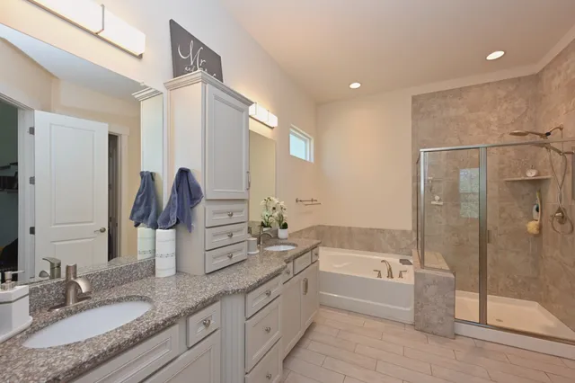 a bedroom with a bed and a workspace