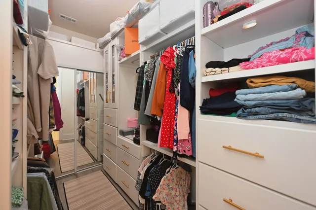 a living room with furniture and gym equipment
