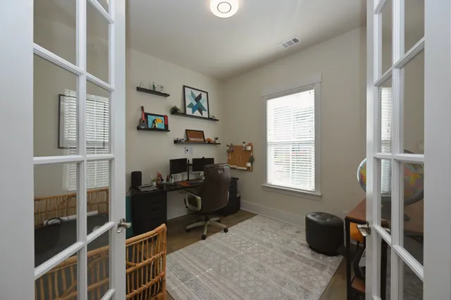 a view of a dining room with furniture window and wooden floor