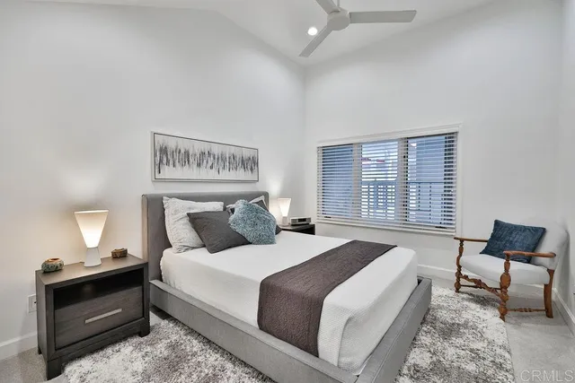 a bedroom with bed and chair