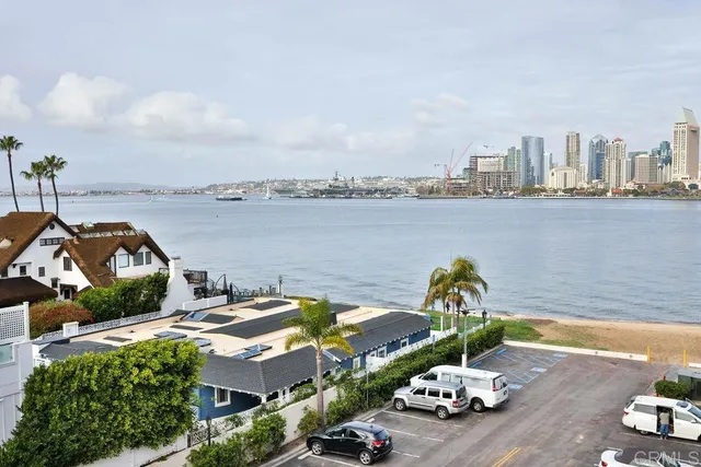 a view of a lake with a table and chairs
