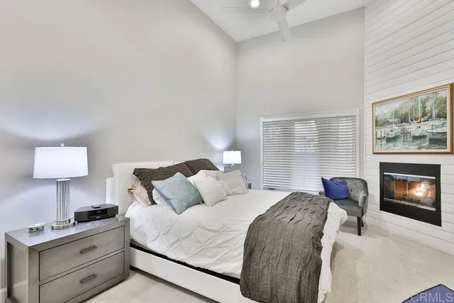 a bedroom with a bed and a fireplace