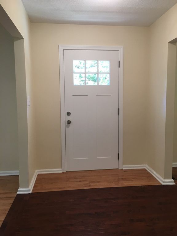 154 New Boston Road Sturbridge, MA 01566 - Photo 16 of 29 an empty room with wooden floor and windows