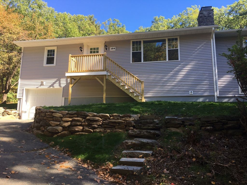 154 New Boston Road Sturbridge, MA 01566 - Photo 3 of 29 a view of a house with a yard