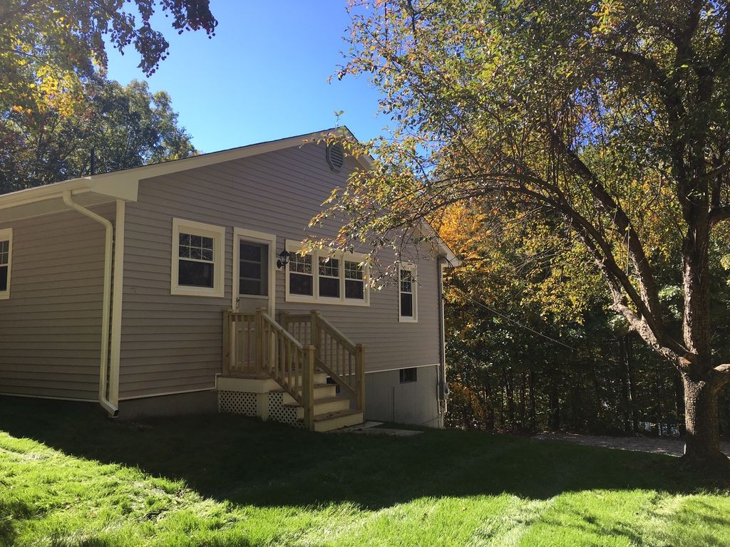 154 New Boston Road Sturbridge, MA 01566 - Photo 5 of 29 a view of a house with a yard