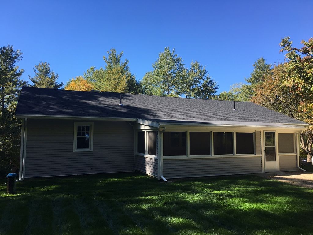 154 New Boston Road Sturbridge, MA 01566 - Photo 7 of 29 a house view with a garden space