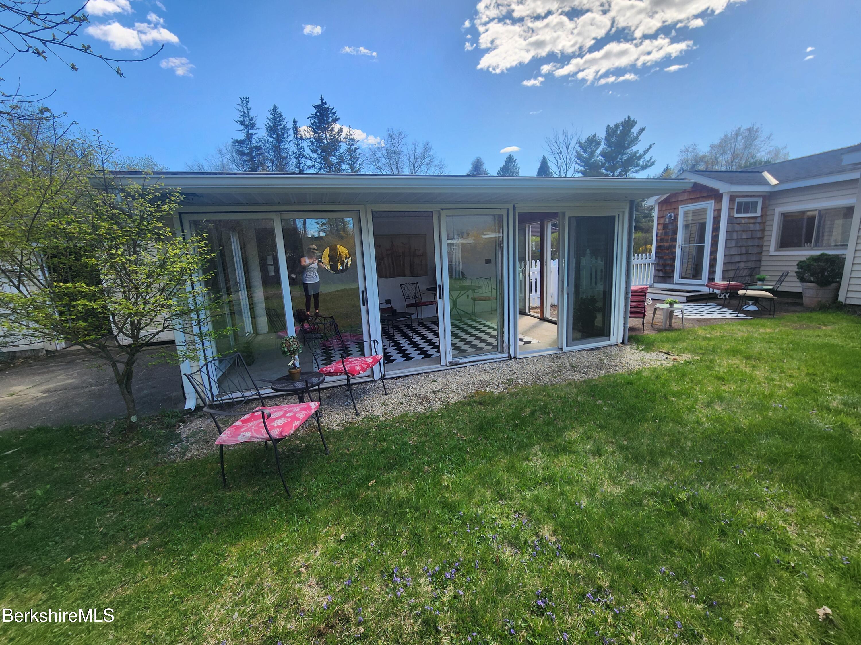 16 East New Lenox Road Lenox, MA 01240 - Photo 5 of 31 a view of a house with a big yard potted plants and large tree