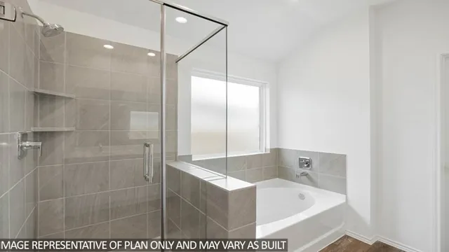 a bathroom with a tub and shower