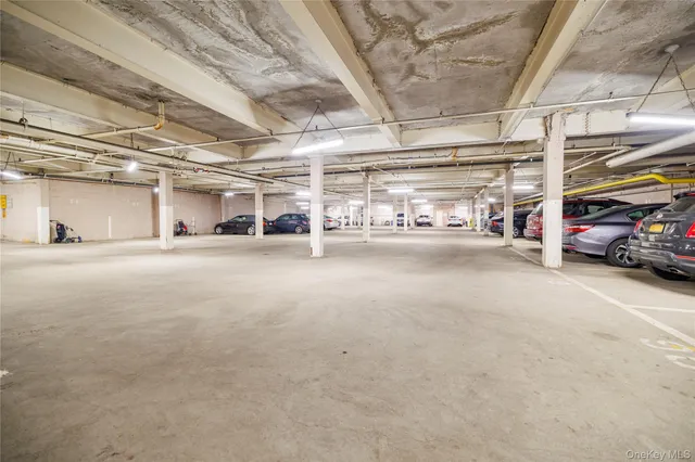 a view of a garage with cars