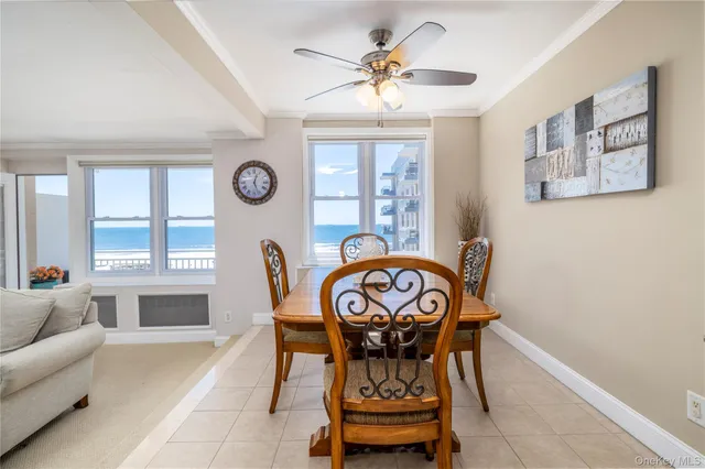 a view of a dining room that has a table and a chair in it