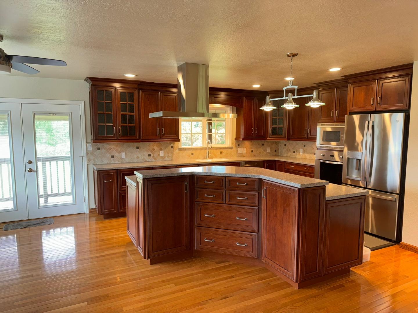 451 Corral De Tierra Road Salinas, CA 93908 - Photo 16 of 55 a kitchen with stainless steel appliances granite countertop a refrigerator and a sink