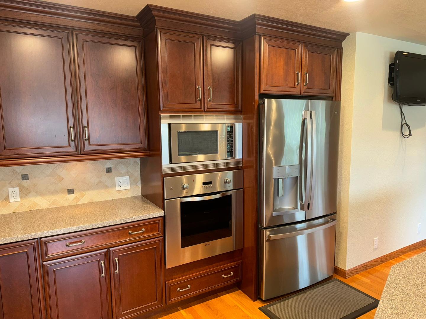 451 Corral De Tierra Road Salinas, CA 93908 - Photo 17 of 55 a kitchen with stainless steel appliances granite countertop a refrigerator and a sink