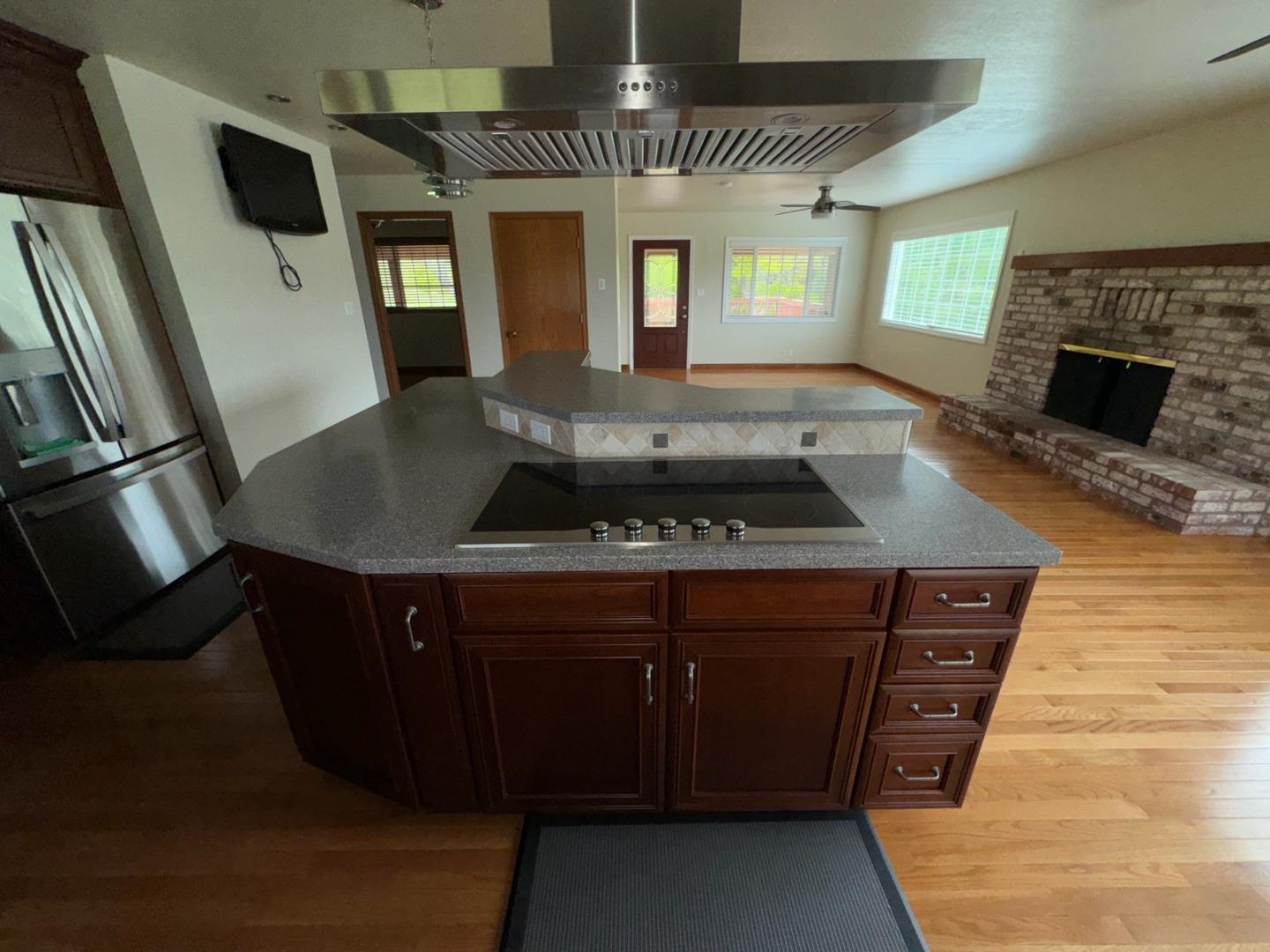 451 Corral De Tierra Road Salinas, CA 93908 - Photo 19 of 55 a kitchen with stainless steel appliances granite countertop a stove a sink and a microwave