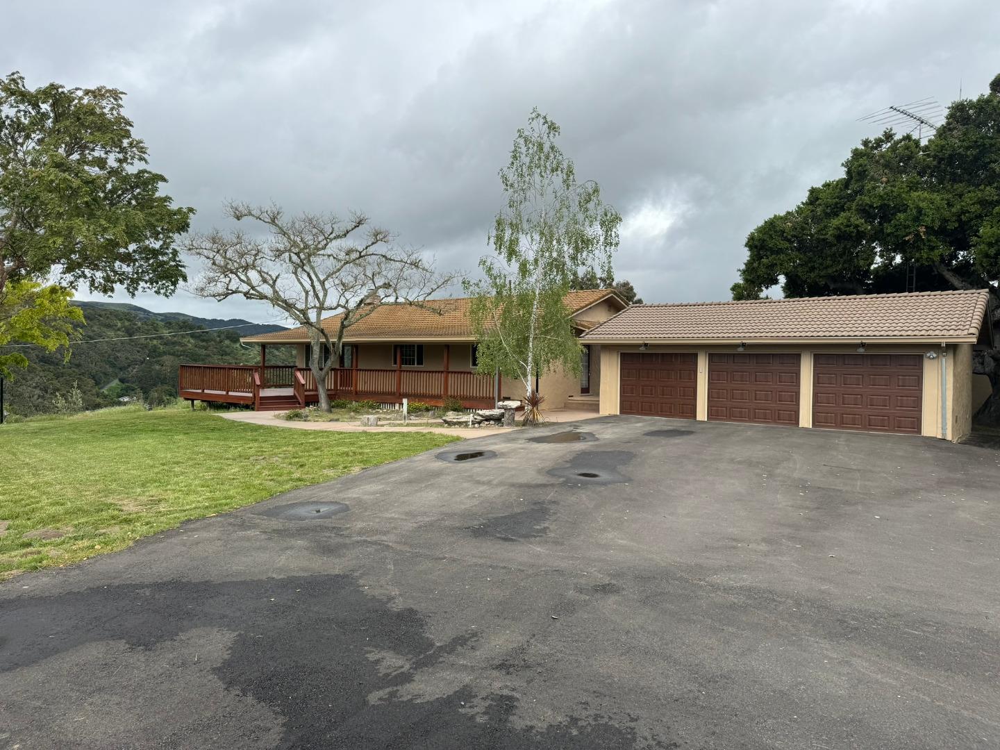 451 Corral De Tierra Road Salinas, CA 93908 - Photo 2 of 55 a view of a house with a yard and palm trees