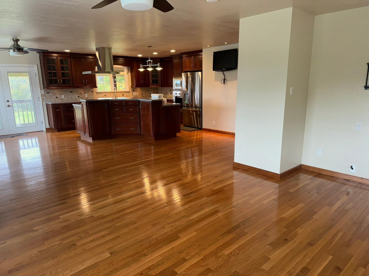 451 Corral De Tierra Road Salinas, CA 93908 - Photo 22 of 55 a view of a living room with kitchen island wooden floor and stainless steel appliances