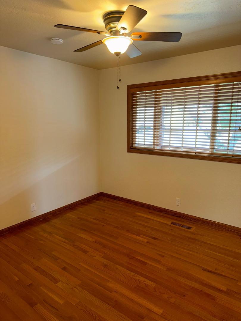 451 Corral De Tierra Road Salinas, CA 93908 - Photo 23 of 55 a view of an empty room with wooden floor and a window