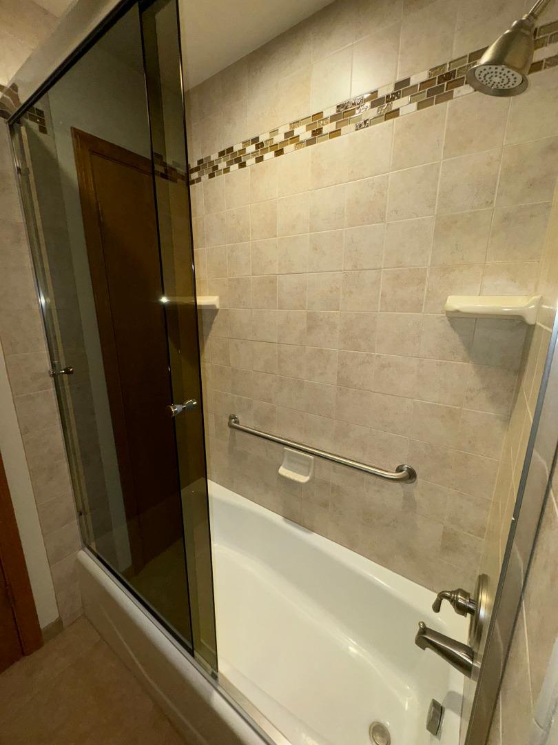 451 Corral De Tierra Road Salinas, CA 93908 - Photo 25 of 55 a bathroom with a shower and a tub