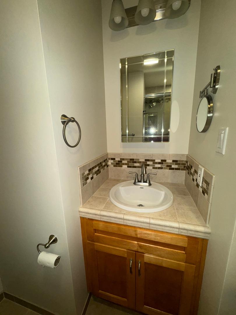 451 Corral De Tierra Road Salinas, CA 93908 - Photo 26 of 55 a bathroom with a sink and a mirror