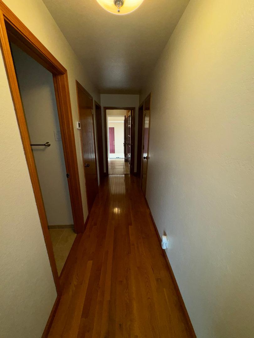 451 Corral De Tierra Road Salinas, CA 93908 - Photo 27 of 55 a view of a hallway with wooden floor and staircase