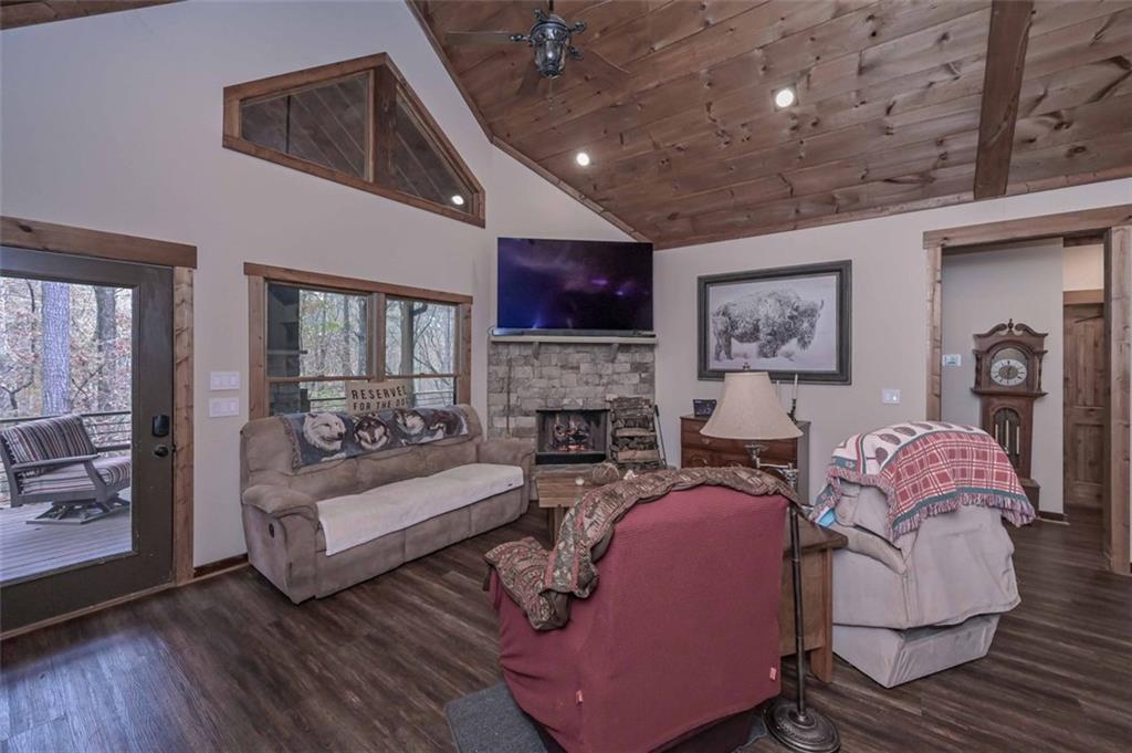 110 Ridge Crest Court Ellijay, GA 30540 - Photo 13 of 33 a living room with fireplace furniture and a flat screen tv