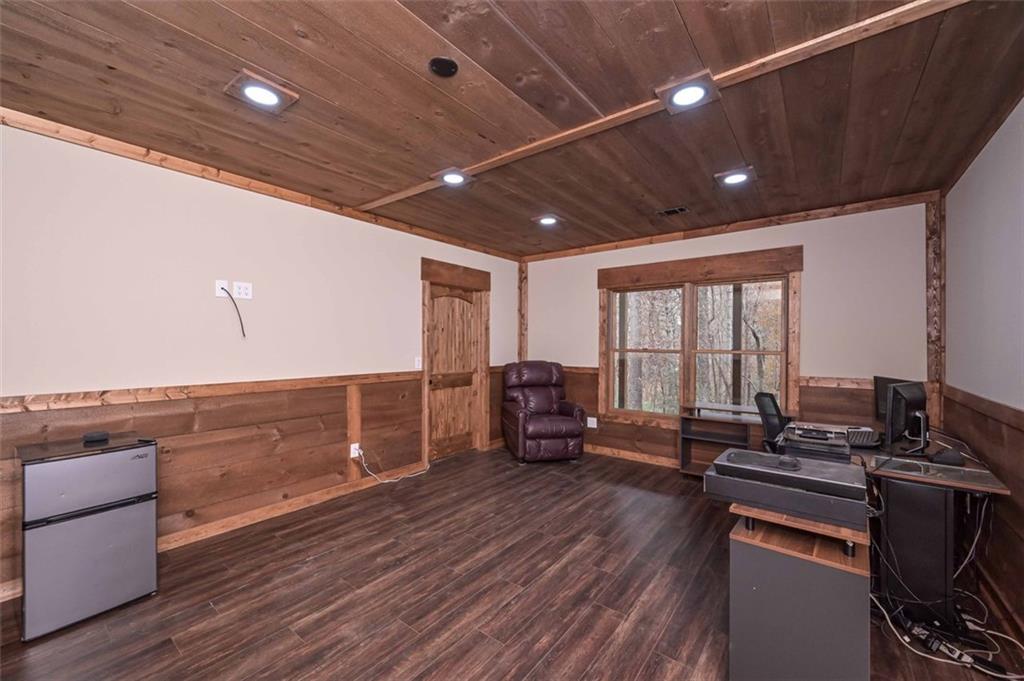 110 Ridge Crest Court Ellijay, GA 30540 - Photo 27 of 33 a living room with furniture and a flat screen tv