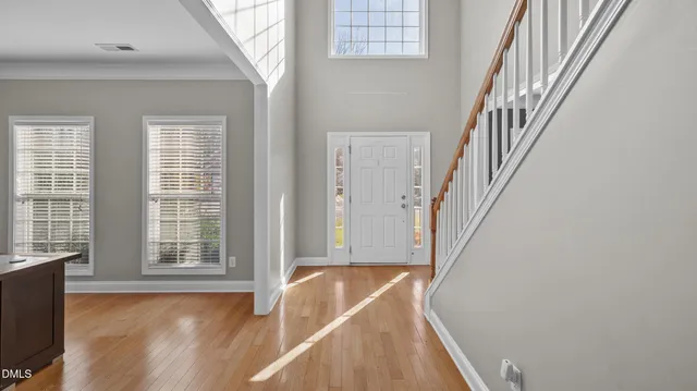 a view of a living room and wooden floor