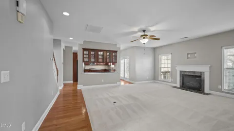 a view of staircase with white walls and windows