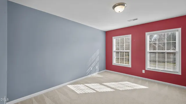 a view of a bedroom with windows