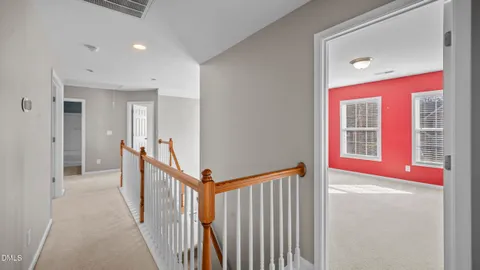 a view of a hallway with windows